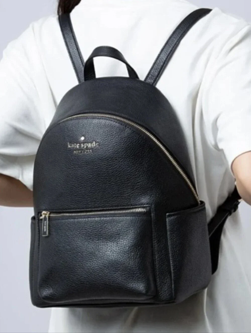 Kate Spade Leila black pebbled leather medium dome backpack with gold hardware